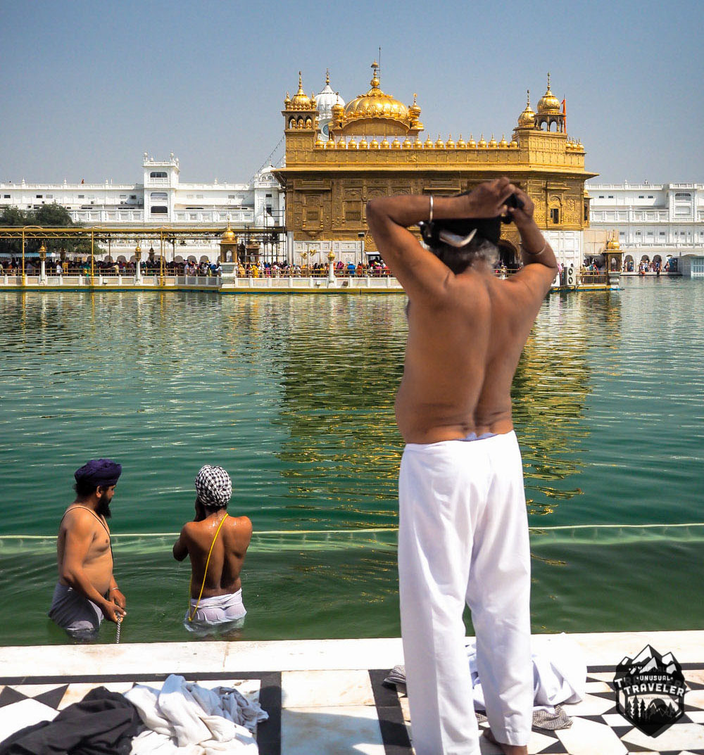 dip in the holy lake around the Golden Temple in India