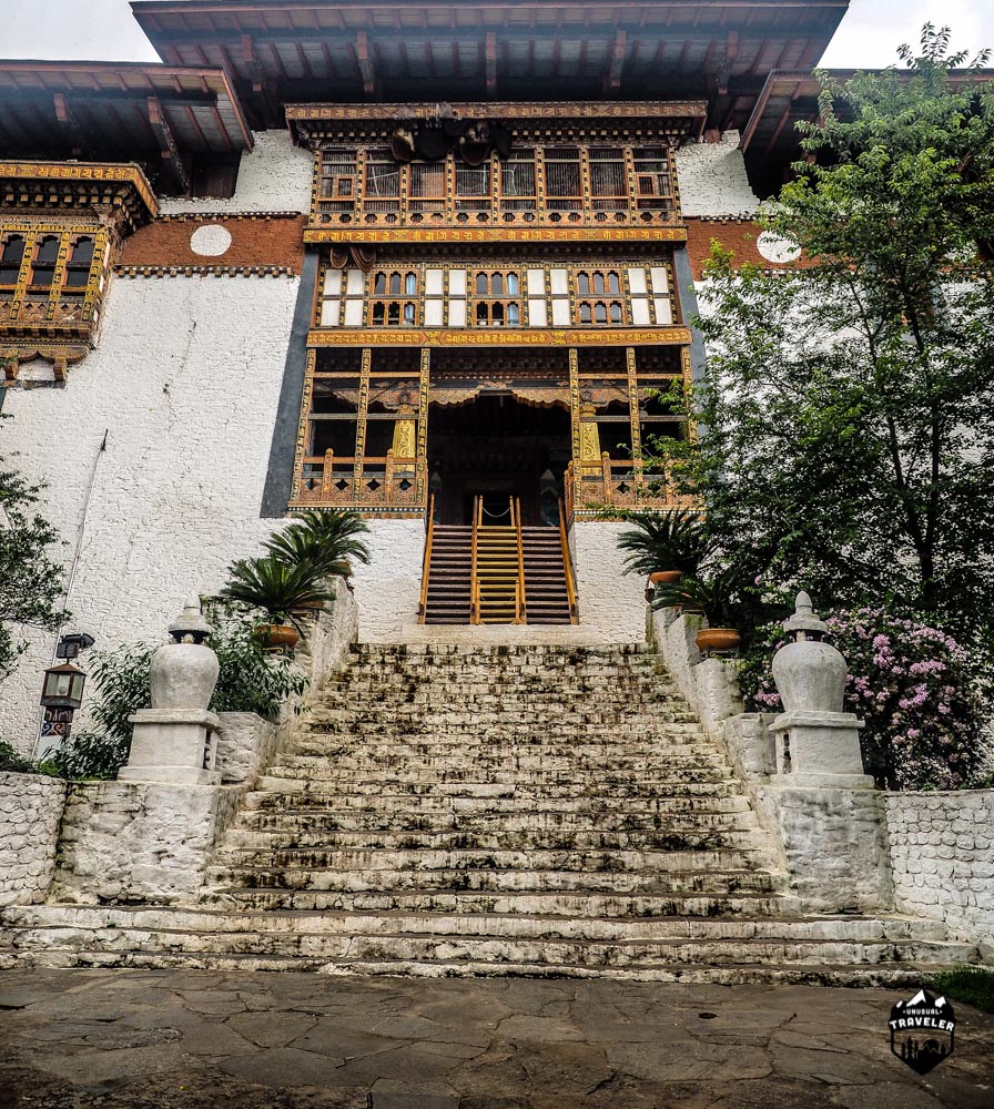 The main entrance to Punakha Dzong, it might not seem steep, but it is. NB, Notice the beehives underneath the roof.