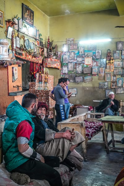 Locals sharing stories inside a local tea house in old Baghdad. in iraq