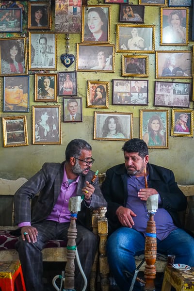 Locals sharing stories inside a local tea house in old Baghdad.