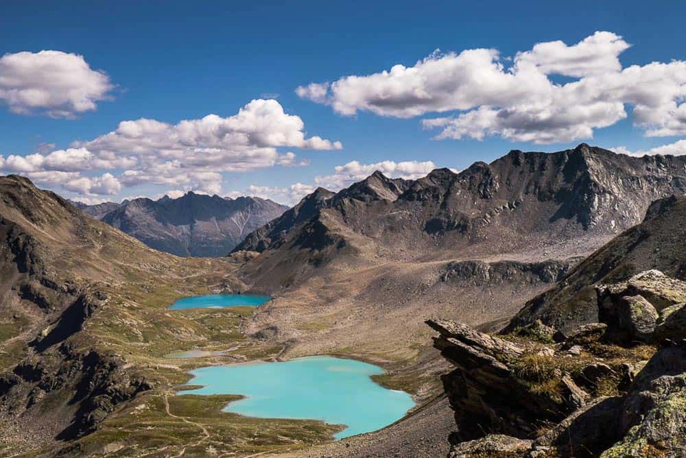 The stunning turquoise blue lakes on the loop around the Joeriseen in Switzerland