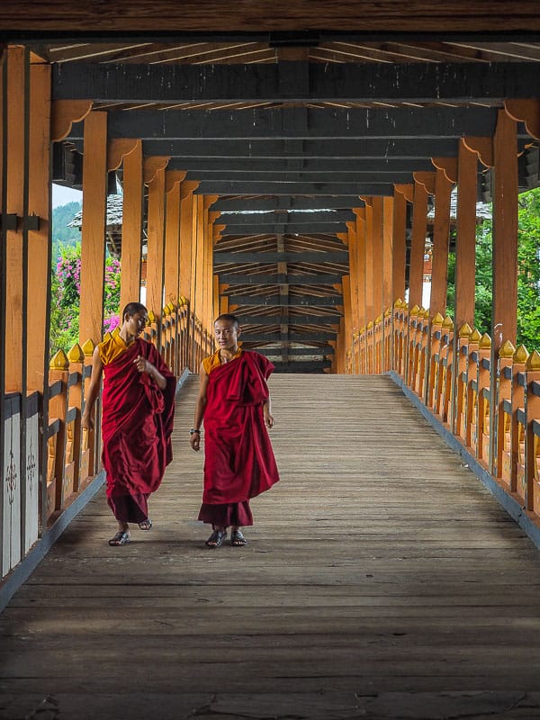 Bhutan monks on bridge