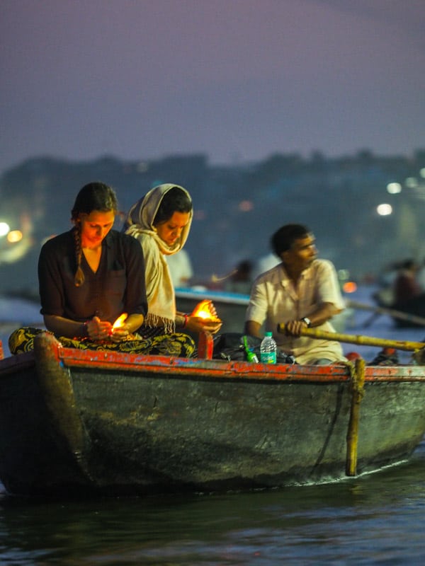 release a lotus flower candle on the river and make a wish in Varanasi India
