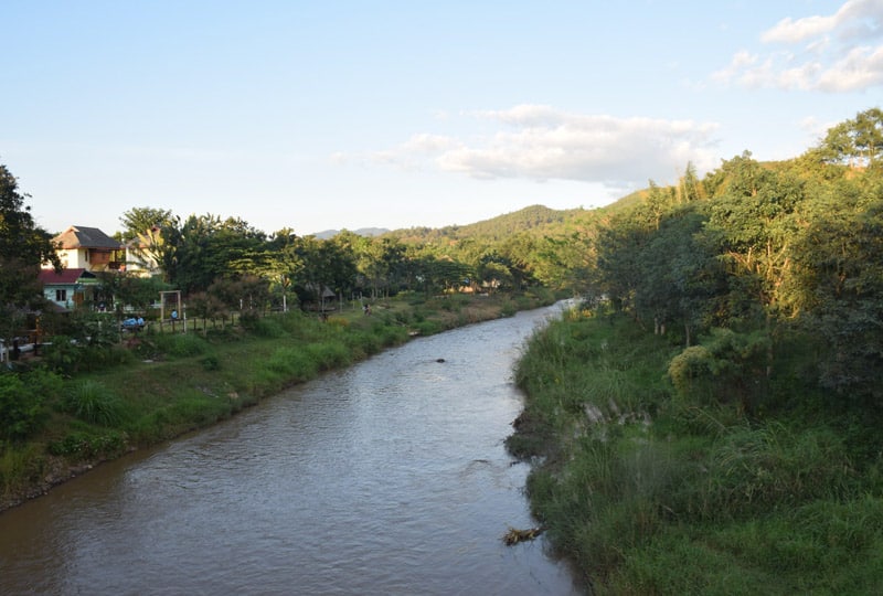 The peaceful river flows through Pai in north Thailand